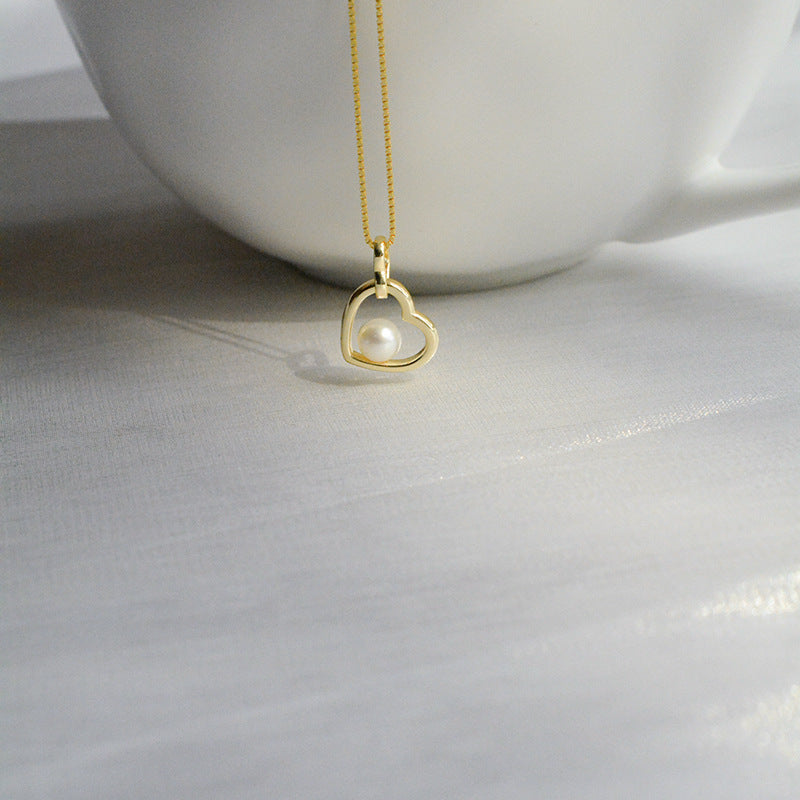 Koyace Hollow Heart-shaped Pearl Pendant Necklace