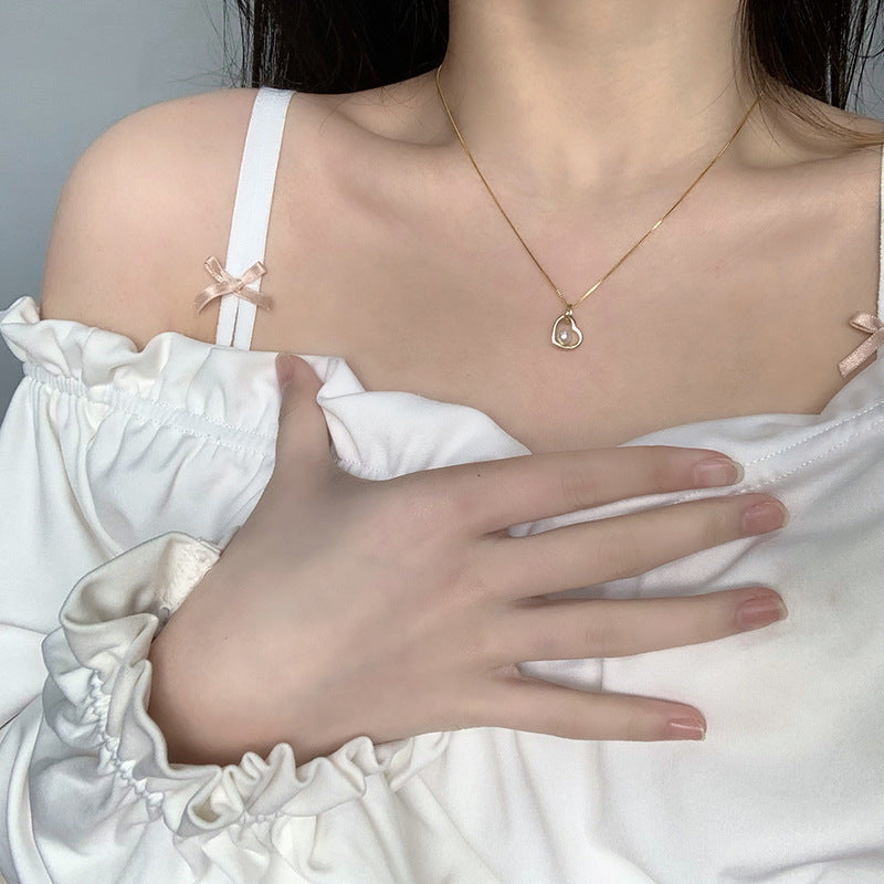 Koyace Hollow Heart-shaped Pearl Pendant Necklace