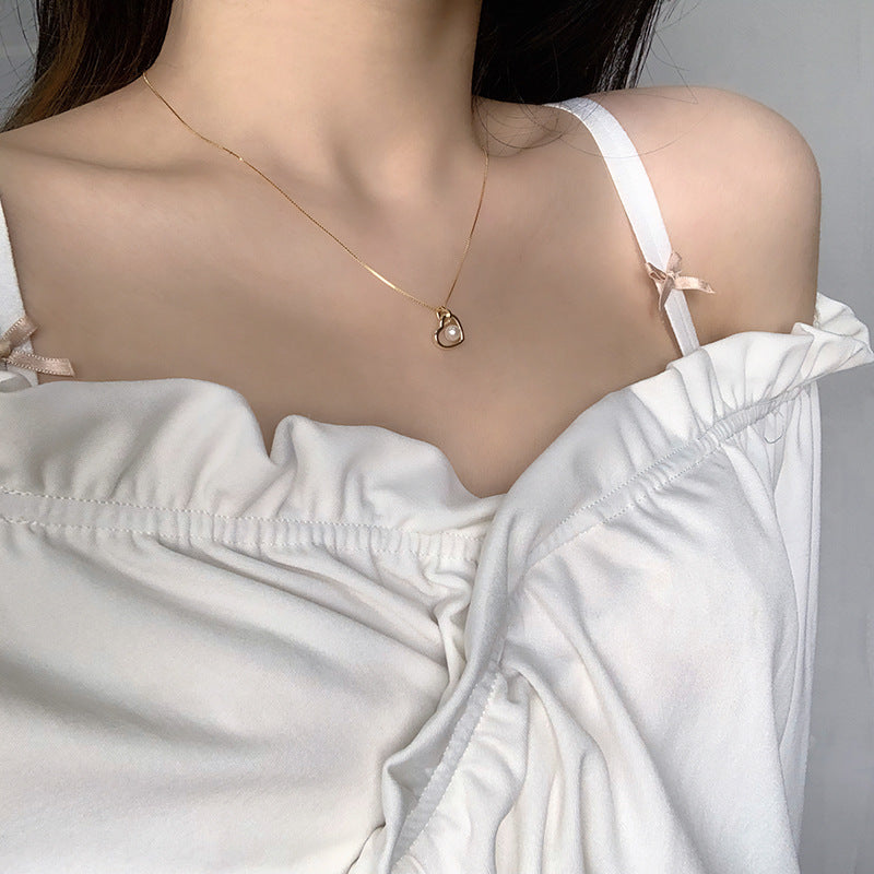 Koyace Hollow Heart-shaped Pearl Pendant Necklace