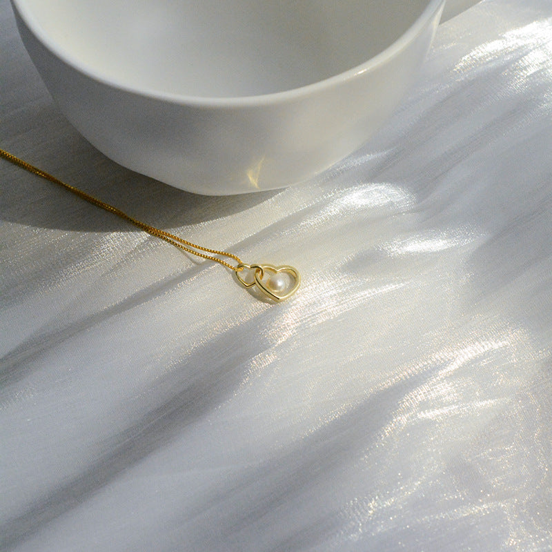 Koyace Hollow Heart-shaped Pearl Pendant Necklace