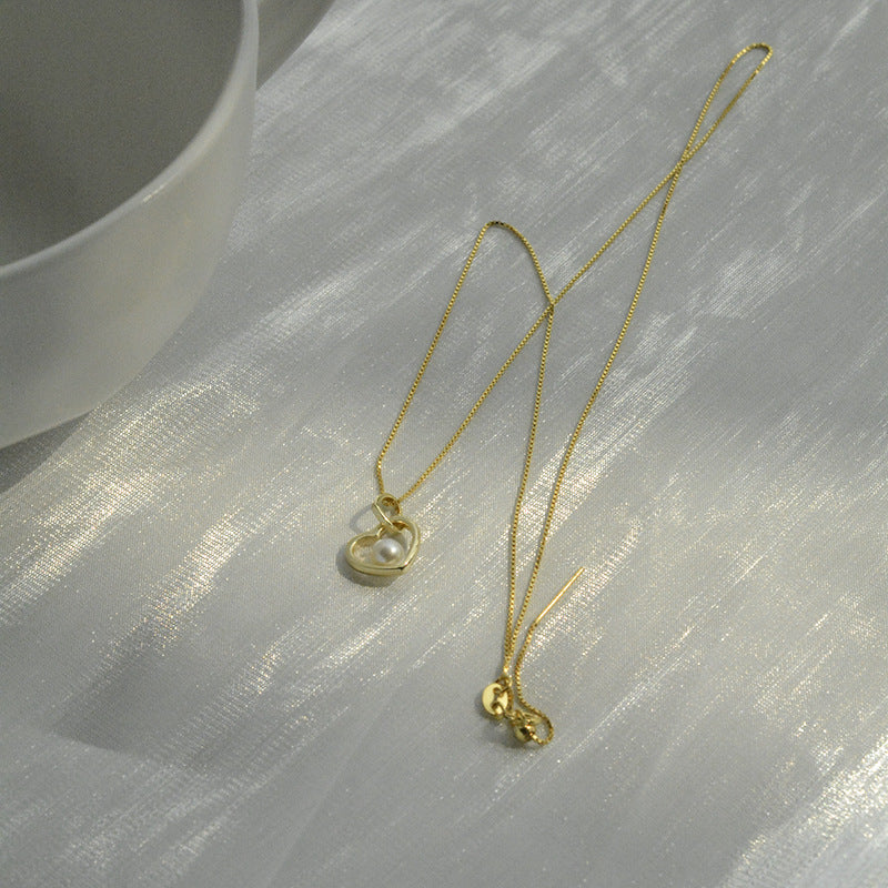 Koyace Hollow Heart-shaped Pearl Pendant Necklace