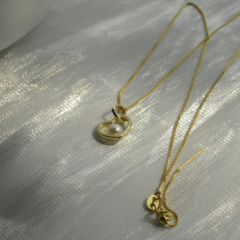 Koyace Hollow Heart-shaped Pearl Pendant Necklace