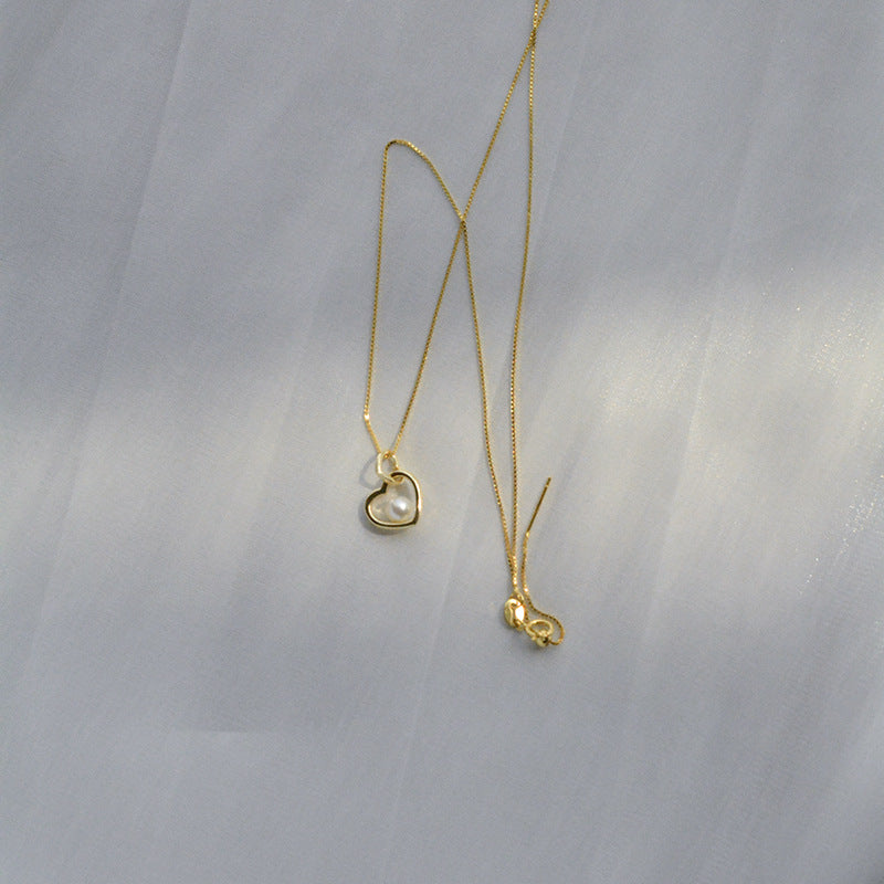 Koyace Hollow Heart-shaped Pearl Pendant Necklace