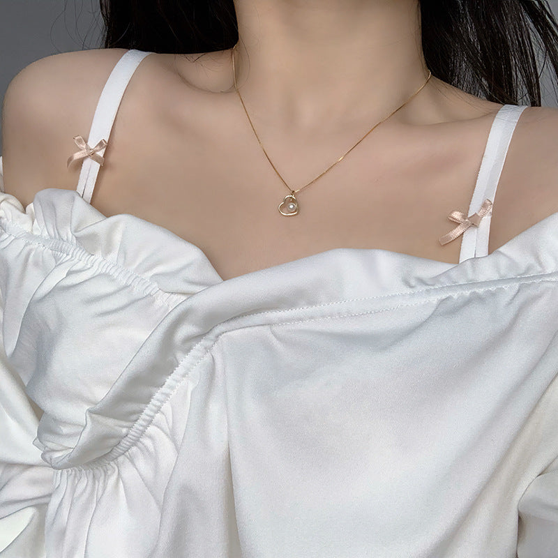 Koyace Hollow Heart-shaped Pearl Pendant Necklace