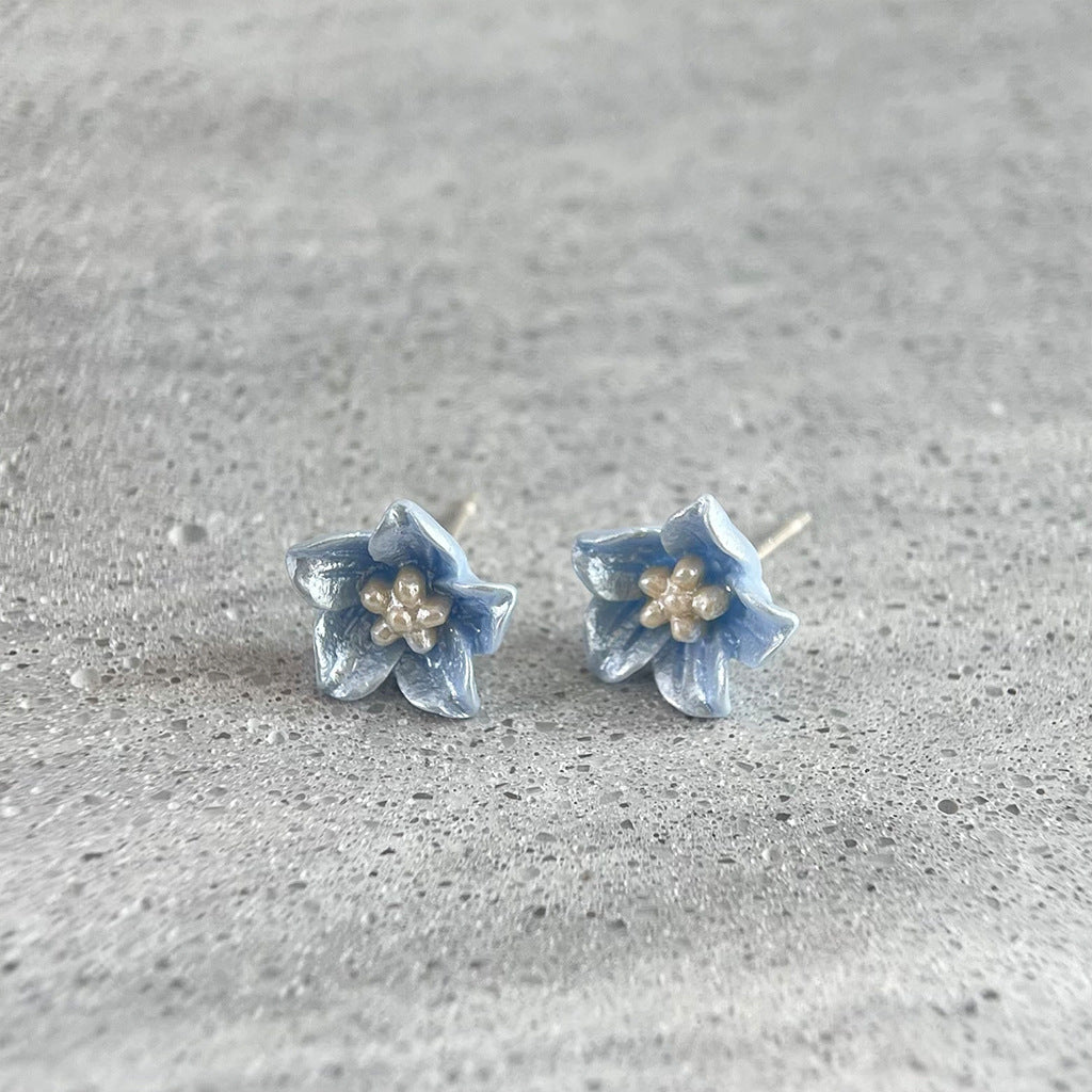 Koyace Klein Blue Resin Flower Stud Earrings