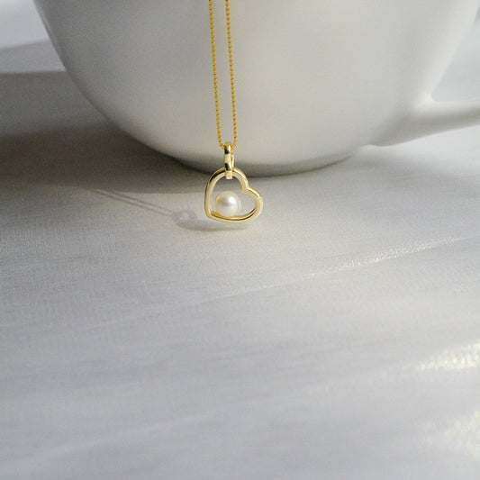 Koyace Hollow Heart-shaped Pearl Pendant Necklace
