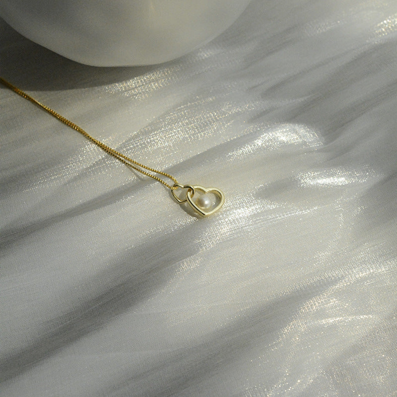 Koyace Hollow Heart-shaped Pearl Pendant Necklace