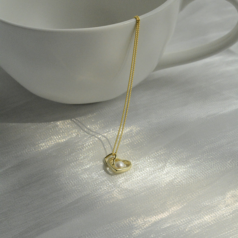 Koyace Hollow Heart-shaped Pearl Pendant Necklace