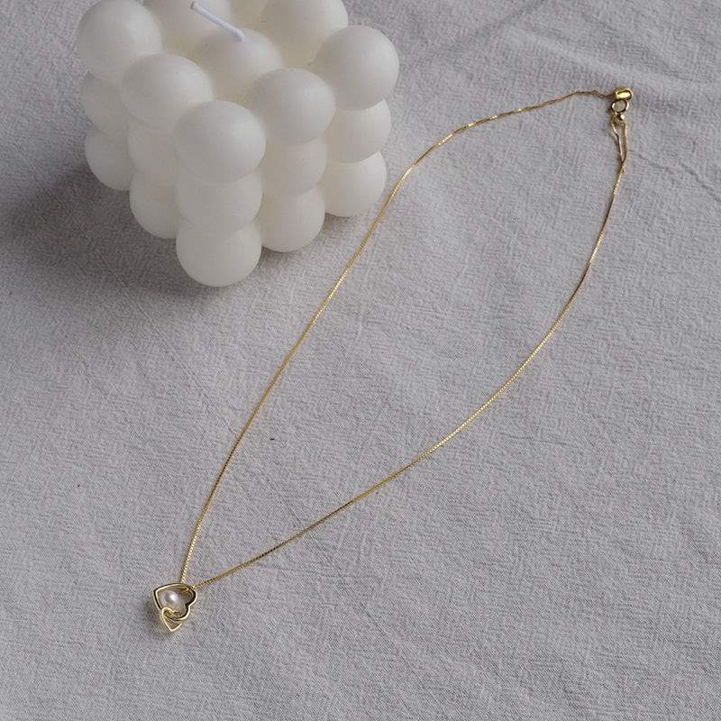 Koyace Hollow Heart-shaped Pearl Pendant Necklace